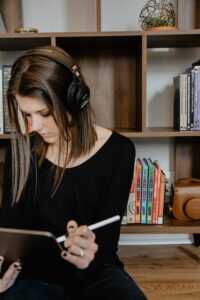 a photo of preparing to make music by actively listening to music