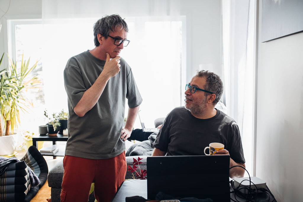 electronic music producer working in studio during creative retreat session |Audioservices.studio