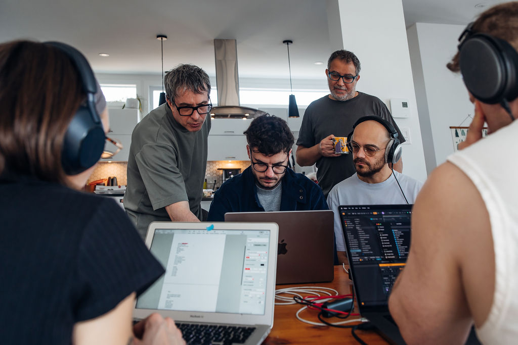 electronic music producer working in studio during creative retreat session |Audioservices.studio